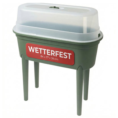 Hochbeet S mit transparenter Abdeckung auf vier Beinen in grüner Farbe