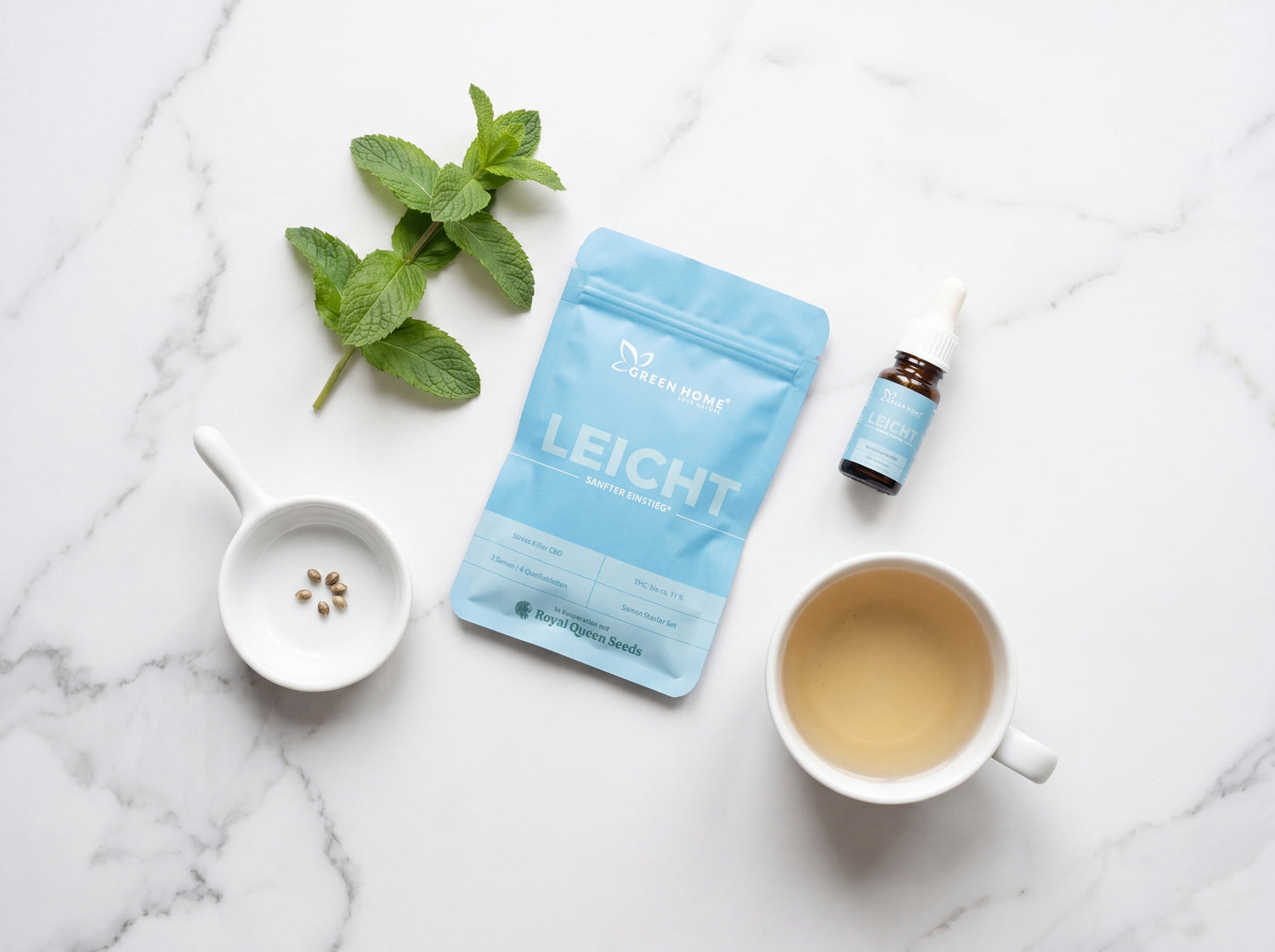 LEICHT Cannabis Starter Set Stillleben mit Minze, Tee und CBD Cannabis Samen auf Marmor